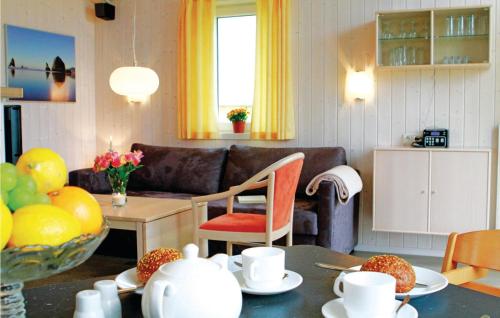 a living room with a couch and a table at Friedrichskoog-Deichblick 22 in Friedrichskoog