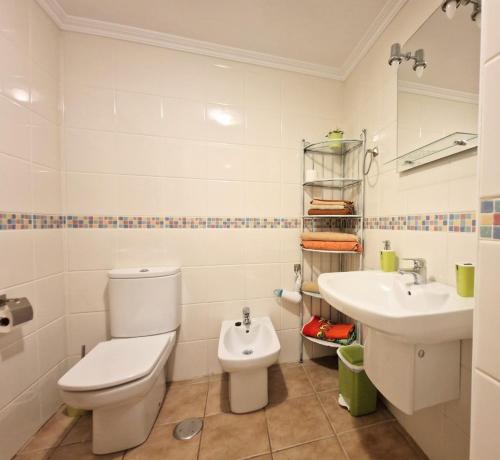 a bathroom with a toilet and a sink at Apartment in La Tejita 2 in La Tejita