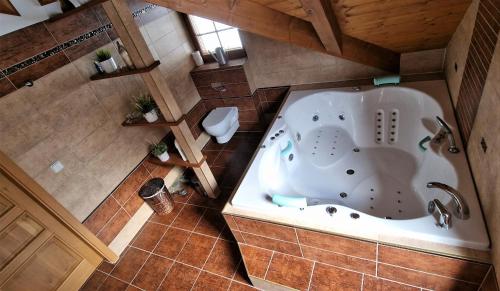 an overhead view of a bath tub in a bathroom at Roubenka Lomná in Horní Lomná