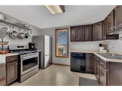 a kitchen with stainless steel appliances and a window at Over 200' of Shoreline on Foot Lake!! Great Fishing Year Round! in Willmar