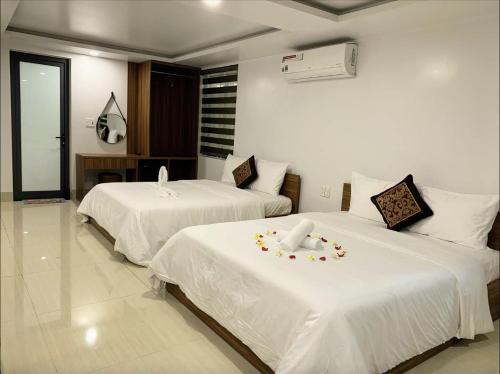 เตียงในห้องที่ Homestay-coffee Ngọc Linh