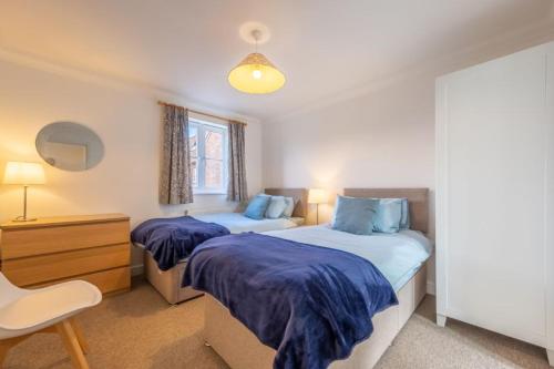 En eller flere senge i et værelse på Rowan Cottage