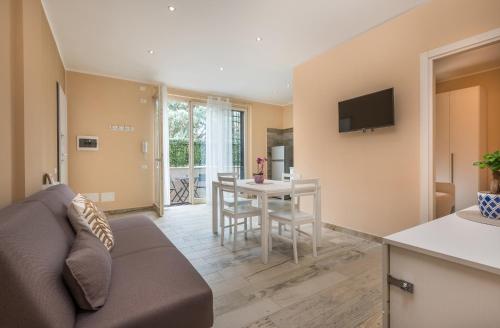 a living room with a couch and a table at Relax Ciampino - By Good Time Apartments in Ciampino