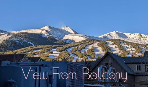 a view of a town with snow covered mountains at Main Street Breck, Walk Everywhere! in Breckenridge