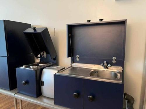 a kitchen with a sink and a stove at Talponia 212 in Ivrea