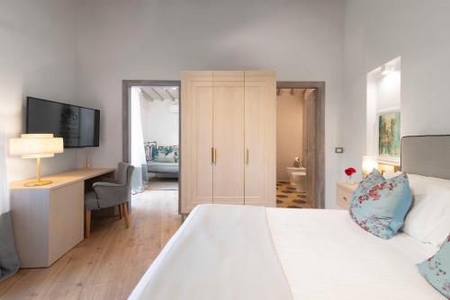 Ένα ή περισσότερα κρεβάτια σε δωμάτιο στο Relais Le Macine Di Stigliano