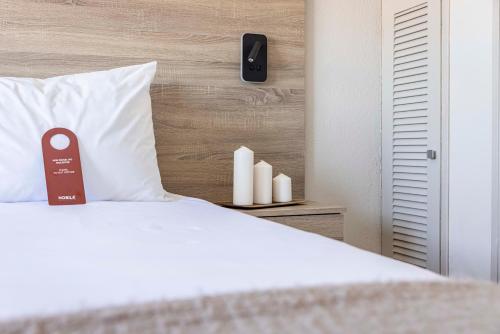 Ένα ή περισσότερα κρεβάτια σε δωμάτιο στο Nobile Hotel Montoya