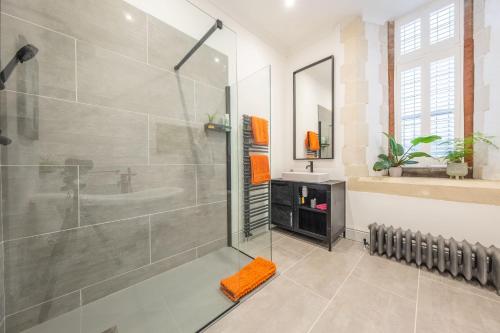 a bathroom with a shower stall and a sink at The Chapel in North Elmham