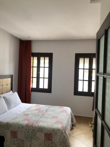 Una cama o camas en una habitación de Mina House