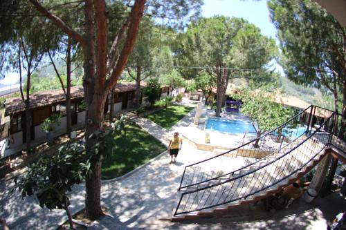 a woman walking down the stairs at a resort at Atillas Getaway in Selcuk