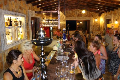 a group of women sitting at a bar at Atillas Getaway in Selcuk