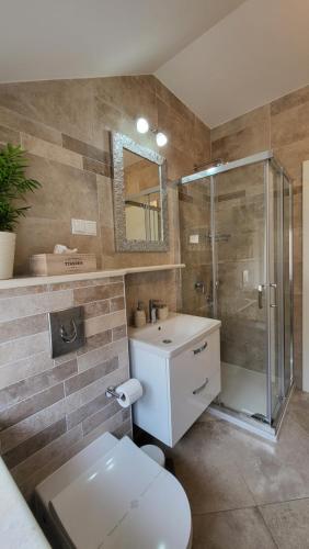 a bathroom with a shower and a toilet and a sink at Korčula Old Town MARIJA Apartment in Korčula