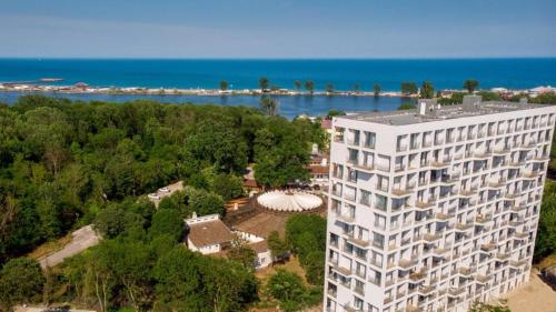 an aerial view of a large white building next to the water at Euphoria Neptun Oxygen in Neptun