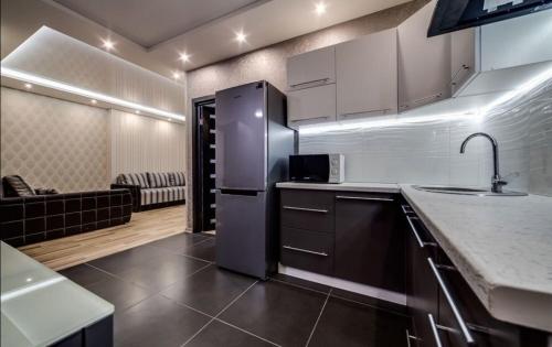 Kuchyň nebo kuchyňský kout v ubytování Comfortable Apartments