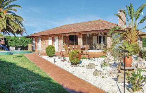 a house with a patio and a swimming pool at 3 Bedroom Awesome Home In Antromero in Candás