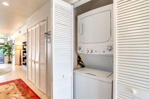 a white laundry room with a washer and dryer at K B M Resorts KRO-Q301 2Bedroom Ocean Views with Free Rental Car in Kaanapali