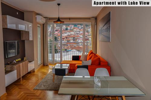 a living room with a couch and a table at Apartments FANTASY with Free Parking in Ohrid