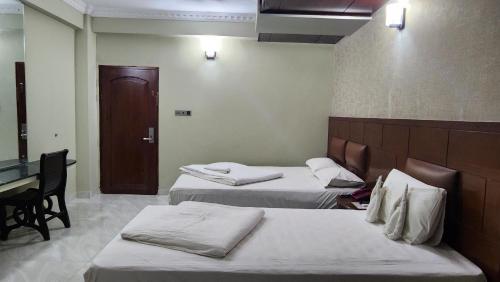 Ένα ή περισσότερα κρεβάτια σε δωμάτιο στο Hotel Media