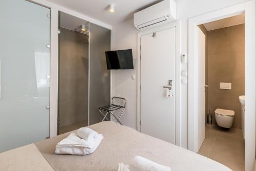 Postel nebo postele na pokoji v ubytování Sperone Hotel