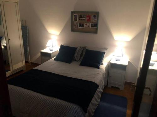 a bedroom with a bed with two lamps on it at Apartamento La Playa , Los Cancajos La Palma in Los Cancajos