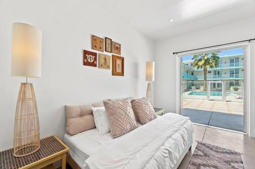 a living room with a white couch and a window at Funky Pool Side Cabana in DTPHX in Phoenix