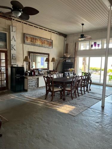 a dining room with a table and chairs at The Purple Martin Lakeside Inn Bird Sanctuary on Lake Huron in Rogers City
