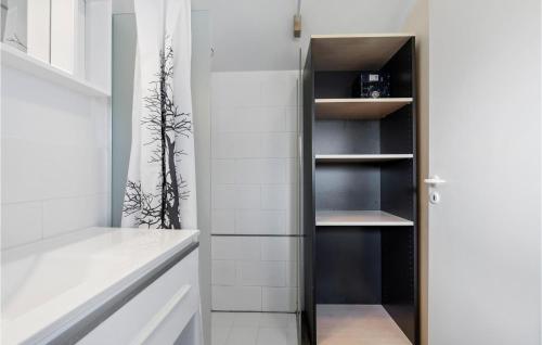 a walk in closet with a black door at Lovely Apartment In Nrre Nebel With Wifi in Nørre Nebel