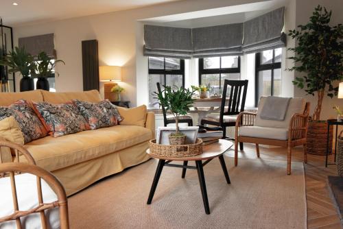 a living room with a couch and a table at Mary's Lane in Randalstown