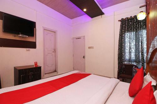 Postel nebo postele na pokoji v ubytování Flagship Hotel Second Paradise