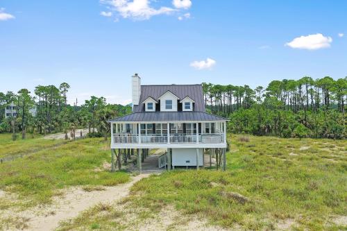 an aerial view of a house on a beach at Coastawhile by Pristine Properties Vacation Rentals in Indian Pass