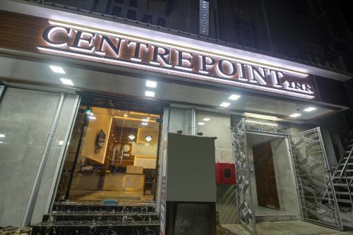 a store front with a sign that reads centennial point at Super Townhouse Centre Point Inn Near Esplanade Metro Station in Kolkata