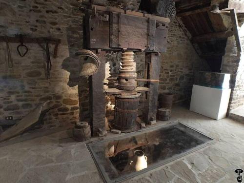 a room with an old fashioned stove in a building at Casa in Borgo Medievale in Toscana in Monterone