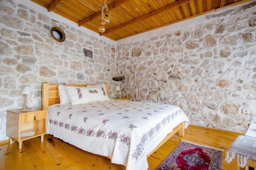 Ένα ή περισσότερα κρεβάτια σε δωμάτιο στο Saklı Konak
