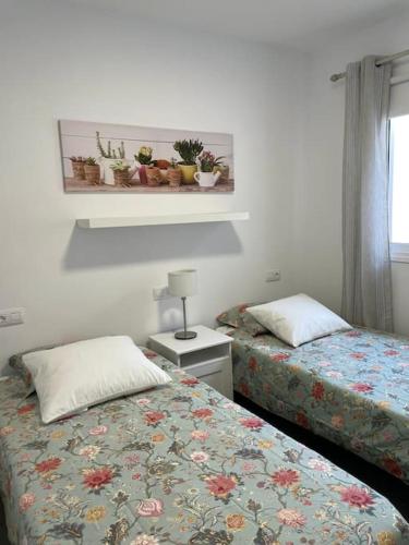 Postel nebo postele na pokoji v ubytování Acogedor bungalow con vistas