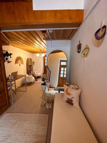 a living room with a couch and a table at Hanole Guest House in Ayvalık