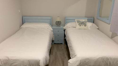 Una cama o camas en una habitación de El Solar de Nené