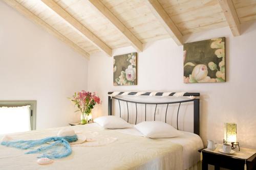 Postel nebo postele na pokoji v ubytování Villa Fotini