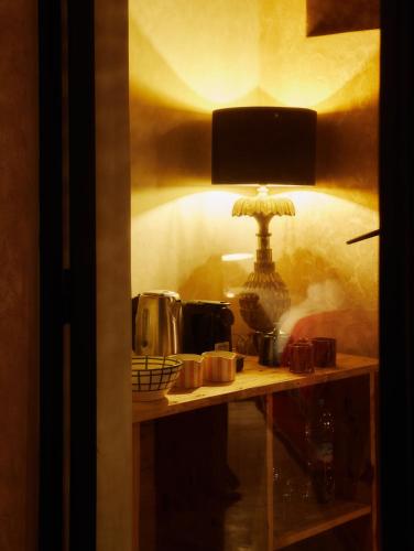 a table with a lamp on top of it at Dar Imiri in Ourika