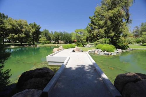 a bridge over a pond in a garden at Retro Studio in the Heart of DTPH - Very Walkable in Phoenix