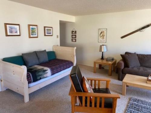 a living room with a couch and a living room with a couch at Rr-interlaken 13 in June Lake