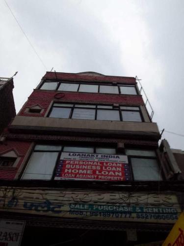 a tall building with signs on the side of it at Flagship 81024 Fabulous Home Stay in New Delhi