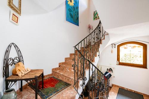 a staircase in a home with white walls at Appart Taverne in Mayrhofen