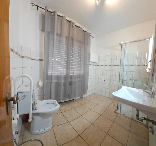 a bathroom with a toilet and a sink at Ca Dei Fiori 1 Venezia in Mestre
