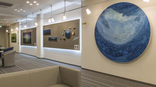 an office with a large blue circle on the wall at Toyoko Inn Nagano-eki Higashi-guchi in Nagano