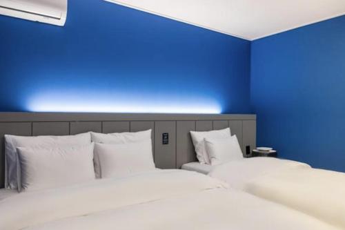Postel nebo postele na pokoji v ubytování Hotel Signature