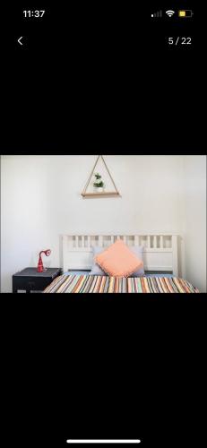 a picture of a bedroom with a bed and a desk at Private Room in Shared Accommodation in Redcliffe