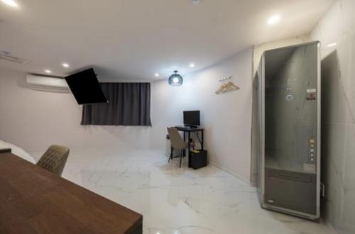 TV a/nebo společenská místnost v ubytování Hotel Signature