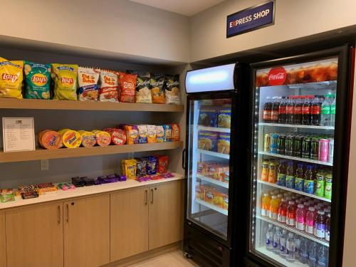 a grocery store with a refrigerator and drinks at Holiday Inn Express & Suites - Courtenay - Comox by IHG in Courtenay