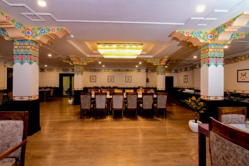 a large banquet hall with tables and chairs at Hotel Barath Ladakh in Leh