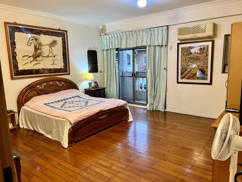 Ένα ή περισσότερα κρεβάτια σε δωμάτιο στο Sin Ya Homestay